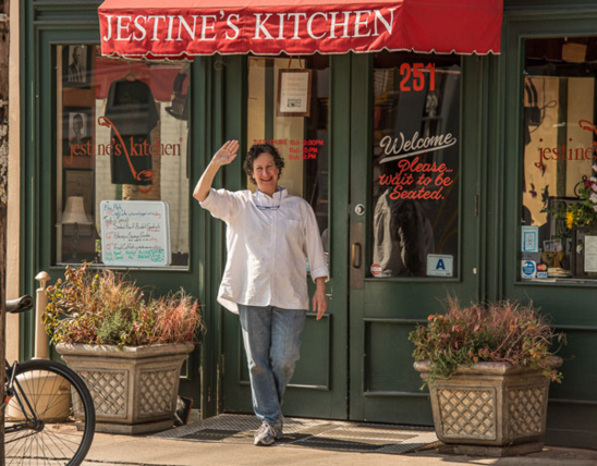 Owner, Dana Strange, in front of Jestine's Kitchen.